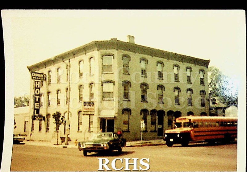 Colored photograph of Cronin's Planter's Hotel and Bar. Shows a three story building with the sign: "Cronin's Hotel" on the side.