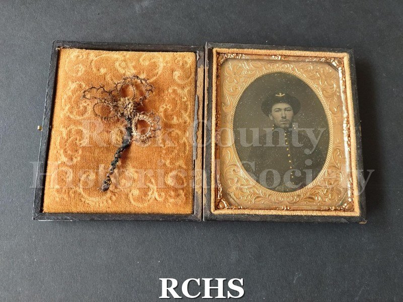 Historic image of Daguerreotype. Daguerreotype of Henry Jones in Civil War uniform. Daguerreotype is inside a brown leather case with tooled design.