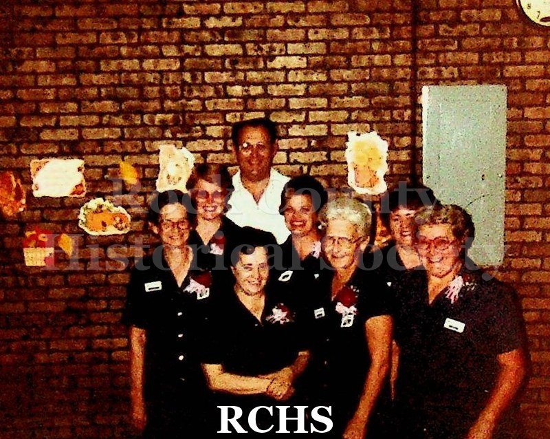 Color photo of Frank Howery and other General Motors cafeteria workers around Thanksgiving.