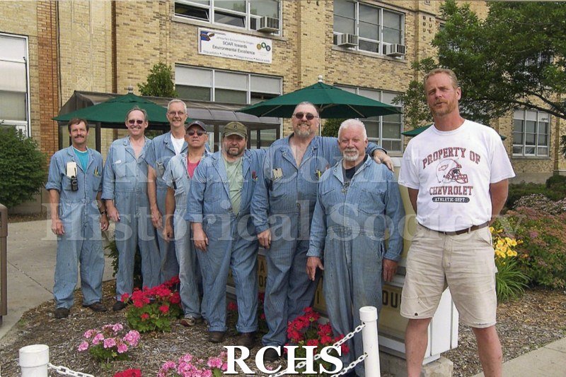 Color photo of Eric "Ike" Johnson and other GM pipefitters standing outside the plant.