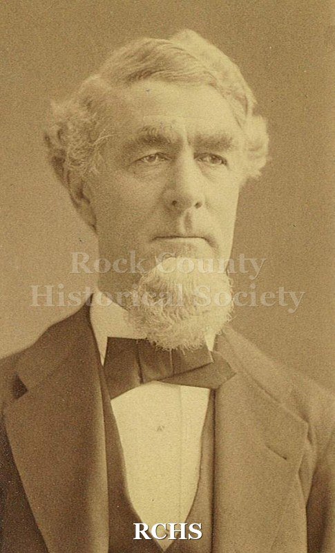 Black and white photograph of William Morrison Tallman. Man with full head of gray hair, rounded beard at chin, bushy eyebrows.