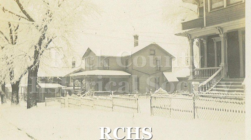 Black and white photograph of Ed Smith's house in the winter.
