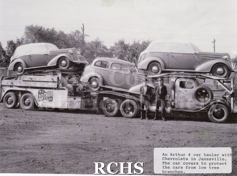 Black and white photograph of a W.R. Arthur 4-car transporter with Chevrolets manufactured in Janesville.