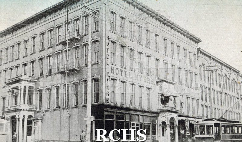 Postcard. Black and white photograph of the Myers Hotel. Postcard is postmarked from Janesville in July 1911, and is addressed to Anna Balgrien in Portage.