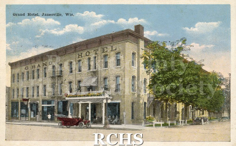 Postcard. Tinted image of the Grand Hotel. Postcard is postmarked from Janesville in September 1917, and is addressed to Anna Balgrien in Portage, Wisconsin.