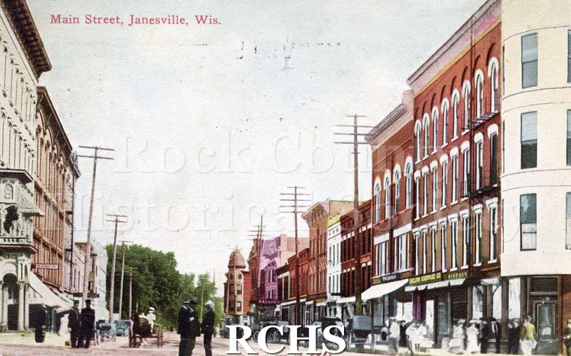Postcard. tinted photo of Main Street in Janesville.