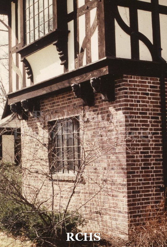 Colored photograph of 200 S. Garfield, Janesville, WI. Shows a two-story house. The first floor is brick and the second floor is a timber-stucco construction.
