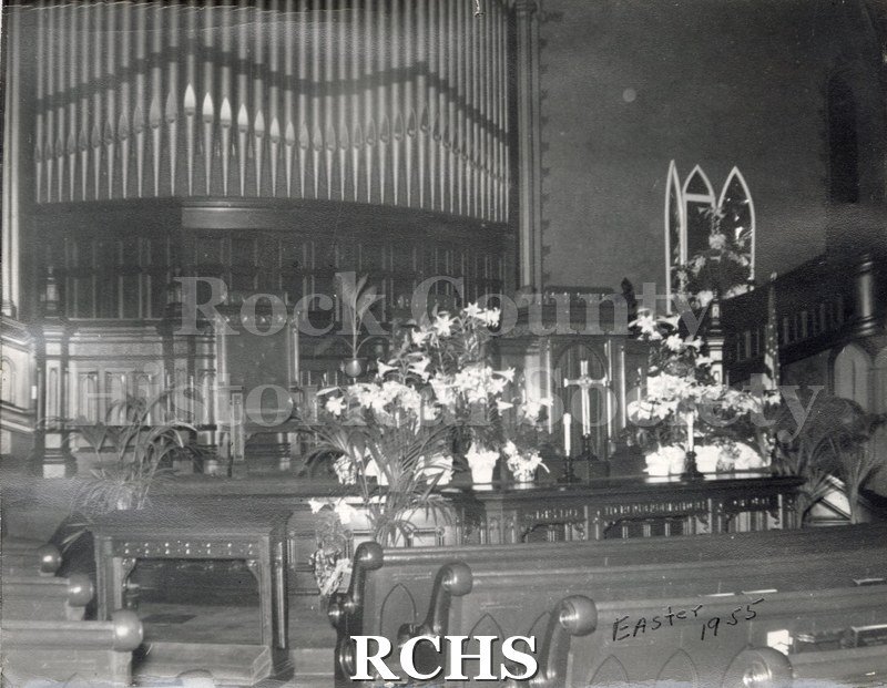 Black and white photograph of the First Congregational United Church of Christ in Janesville decorated for Easter.
