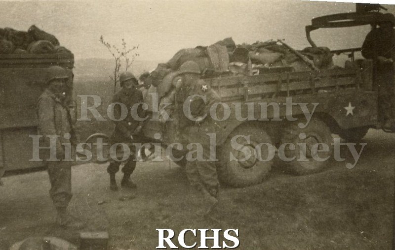 Black and white photograph of a group of U.S. soldiers. Photo was taken by Harvey Thompson (1920 - 1978), who lived at 213 Water Street in Janesville.