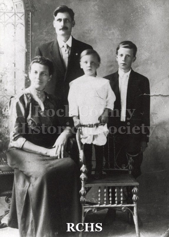 Black and white photograph of Thorwald and Martine Samson with their son Martin and Carl (on the chair).