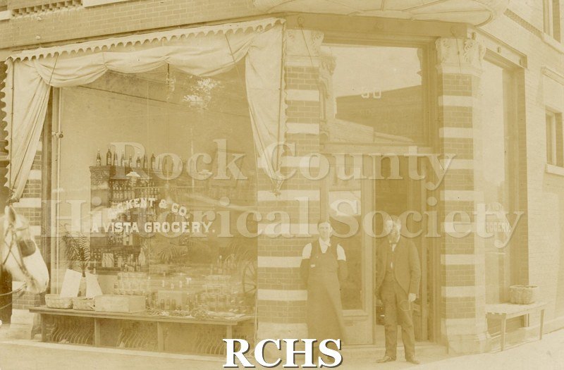 Black and white photograph of Kent Block (La Vista Grocery) corner of East Court and South Main Street. (2).