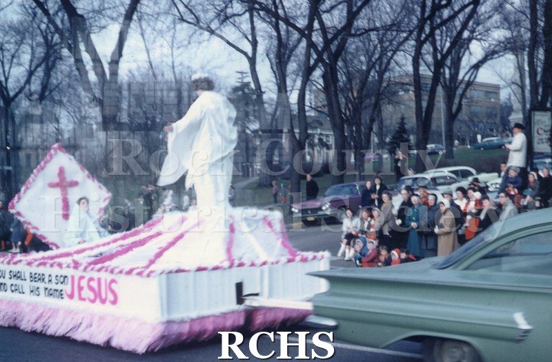 Color photo of the Janesville Christmas parade on South Main Street in December 1960.