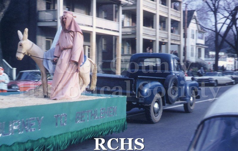 Color photo of the Janesville Christmas parade on South Main Street in December 1960.
