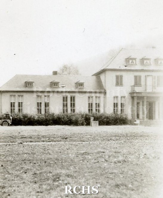 Black and white photograph of U.S. troops moving in to an unknown location in Germany.