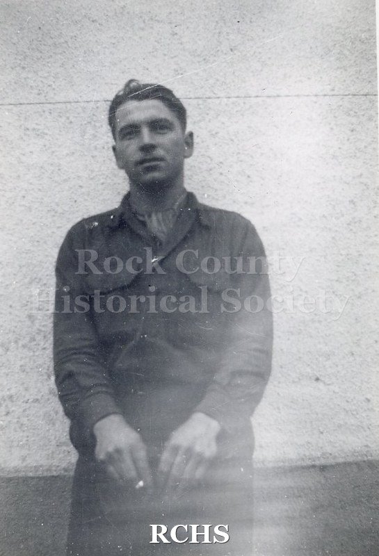 Black and white photograph of an unidentified soldier. Photo was taken by Harvey Thompson (1920 - 1978), who lived at 213 Water Street in Janesville.