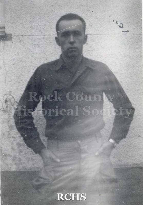 Black and white photograph of an unidentified soldier. Photo was taken by Harvey Thompson (1920 - 1978), who lived at 213 Water Street in Janesville.
