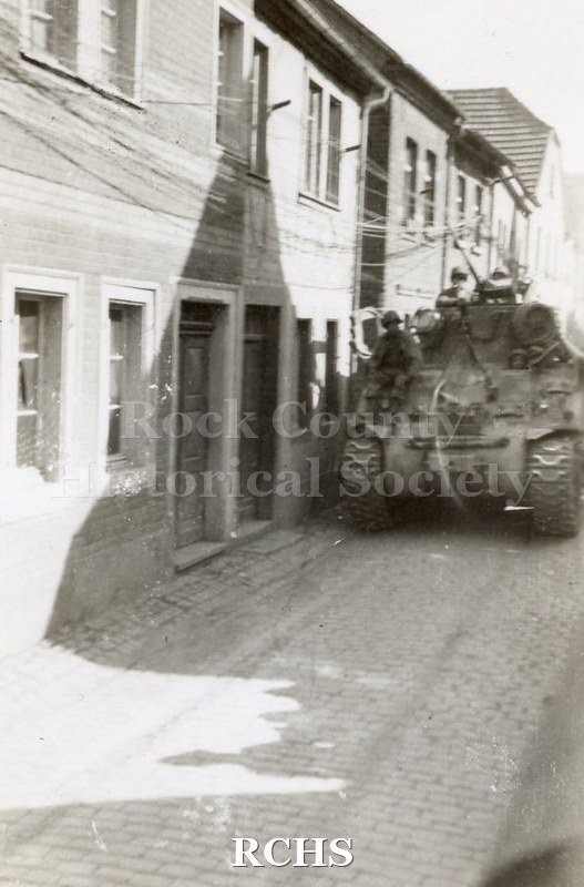 Black and white photograph of U.S. troops moving in to an unknown location in Germany.