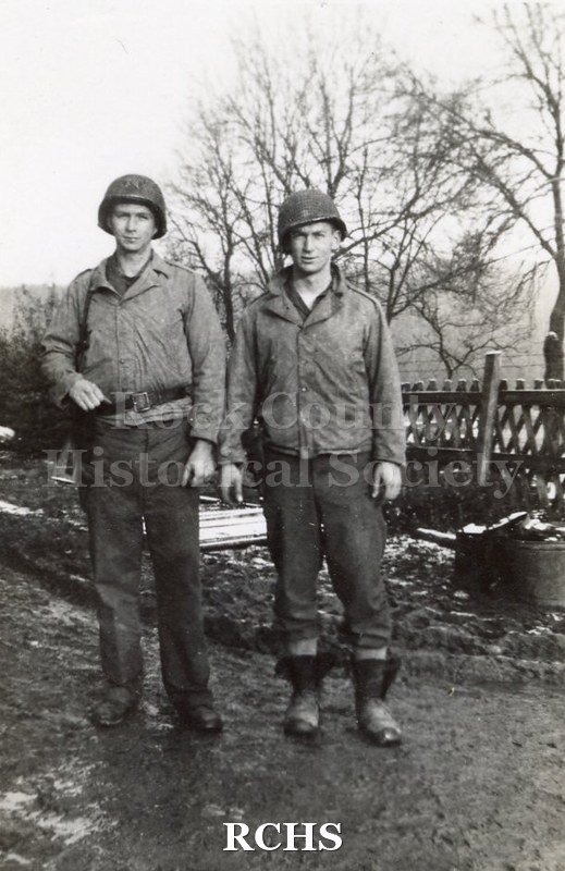 Black and white photograph of Harvey Thompson and "Red." Photo was taken by Harvey Thompson (1920 - 1978), who lived at 213 Water Street in Janesville.