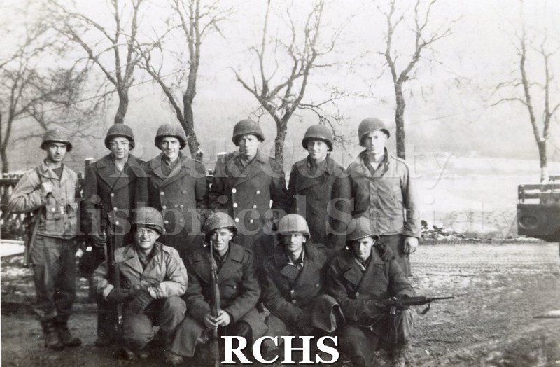 Black and white photograph of a group of US soldiers. Photo was taken by Harvey Thompson (1920 - 1978), who lived at 213 Water Street in Janesville.