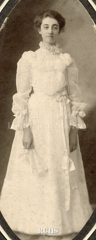Black and white portrait of Maude V. Dickinson at her high school graduation.