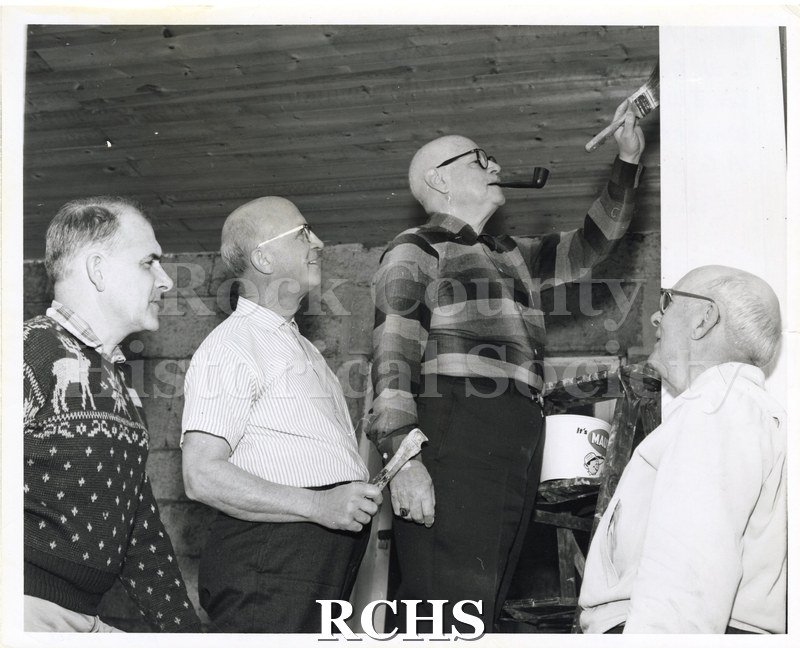 Black and white photograph of volunteers preparing the RCHS Stone House for public exhibition in April 1967. From left to right: A.W. Dunwiddie, Jr.