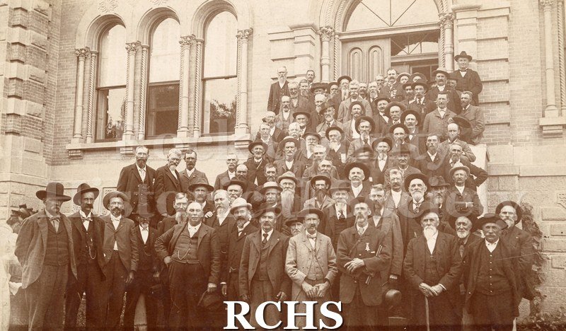 Photo. Black and white photograph of the reunion of the 13th Wisconsin Civil War Veterans (Company C), Janesville, Wis., about 1908, Court House." Newspaper article.