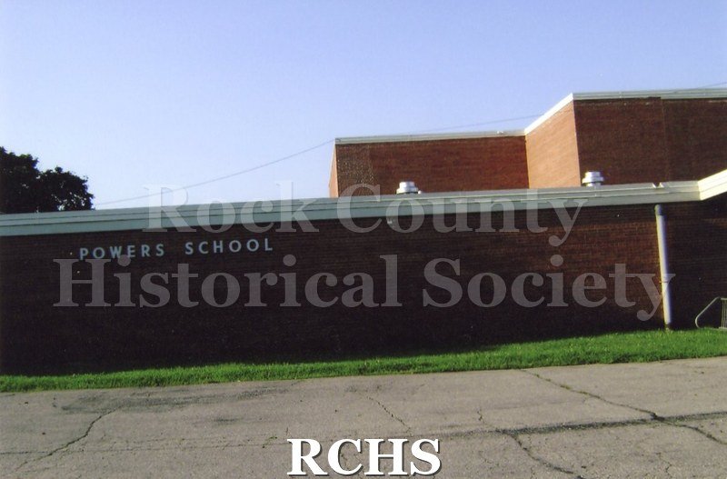 Historic image of Photogrpah. Colored photogrpah of Powers Elementary School, 620 E. Hillside Rd, Beloit. Orange color brick building.