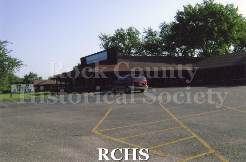 Colored photograph of Good New Christian Center, Non-Denominational. 2293 Prairie Ave., Beloit. Brown one story church.