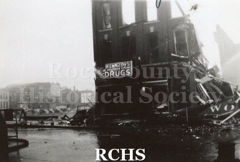 Black and white photograph of Milwaukee Street bridge fire 1942 showing side of building missing roof, windows and front side collapsed in.