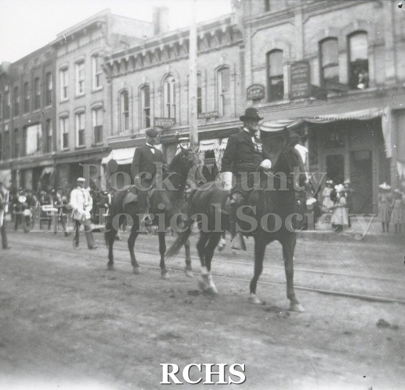 Black and white photograph of the parade marshall in a Janesville parade, possibly for the 4th of July.