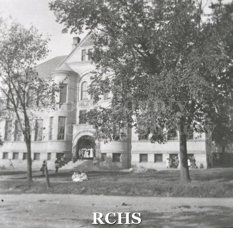 Black and white photograph of the exterior of Douglas School on W. Racine Street.