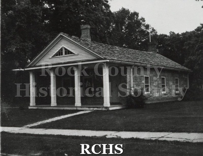 Black and white photograph of the Stone House on the Tallman campus. Appears to be framed.
