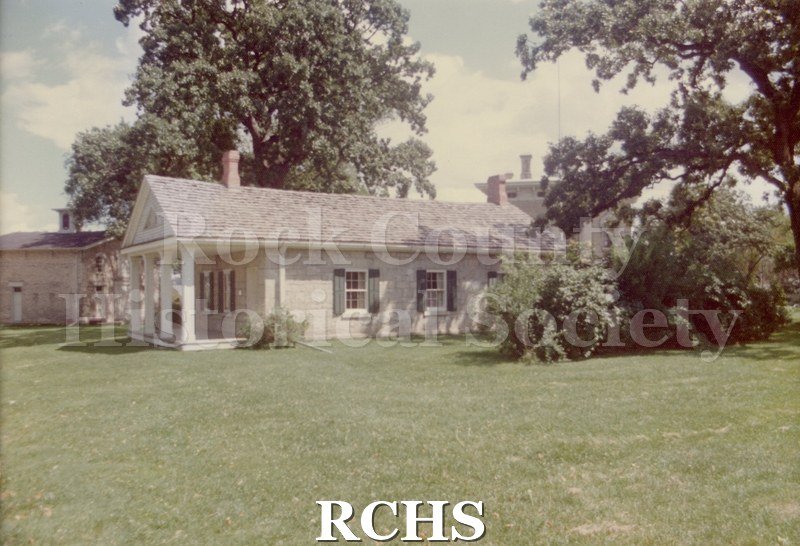 Color photo of the exterior of the RCHS Stone House. Photo by: Wells Photo Service 1313 Sherman Avenue Janesville, Wis. 53545 Phone: (608) 756-3482.