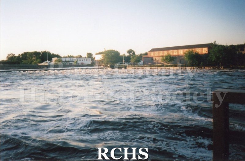 Color photo of the Rock River during the 2008 flood in Janesville. Looking toward Centerway Bridge and Schlueter Company.