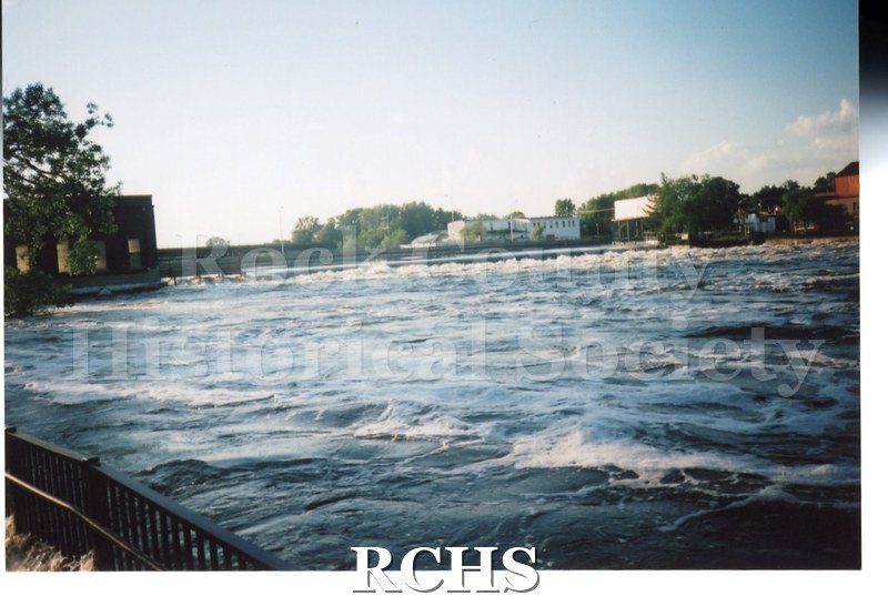 Color photo of the Rock River flooding during the June 2008 flood in Janesville. View from the west bank of the river looking east towards Centerway bridge.