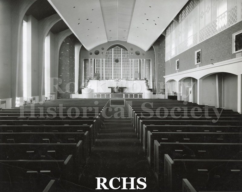 Black and white photograph of the interior of Cargill Methodist Church, looking from the pews toward the altar.