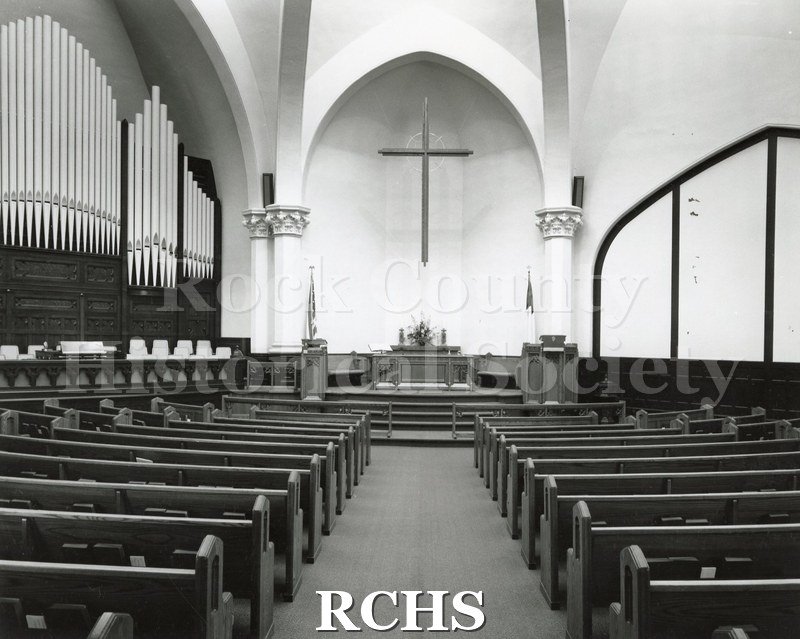 Black and white photograph of the interior of an unidentified church in Decatur, IL, looking toward the front.