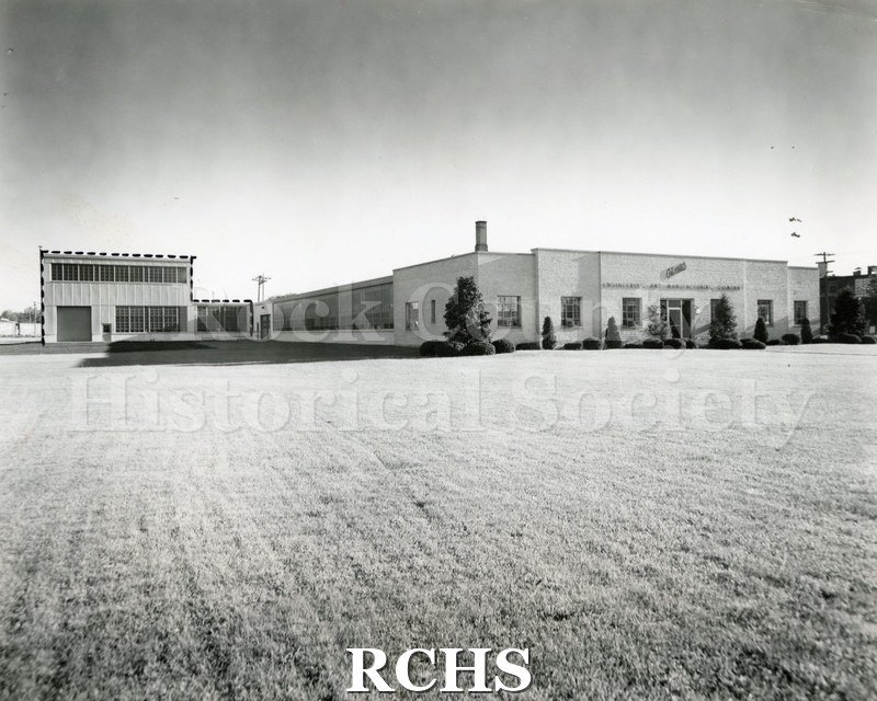 Black and white photograph of Gilman Engineering and Manufacturing Company building. Typewritten material on construction is included. "Gilman Engineering & Mfg.