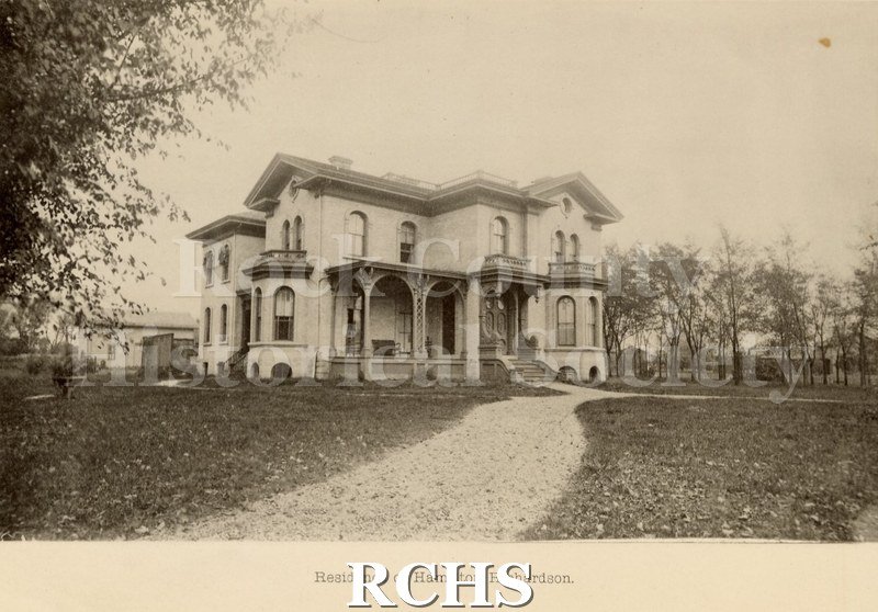 Black and white photograph of the residence of Hamilton Richardson. Shows a two story house with a porch in front and balconies on the second floor.