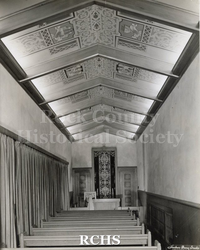 Black and white photograph of the interior of Chapel, Grace Lutheran Church, Springfield, IL, showing one row of pews leading up to the altar.