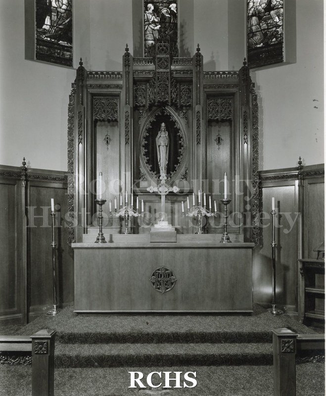 Black and white photograph of the interior of Calvary Cathedral, Sioux Falls, SD, showing the altar area.