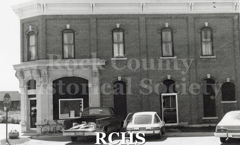 Black and white photograph of Gilbank in Clinton, Wisconsin, a two story brick building.