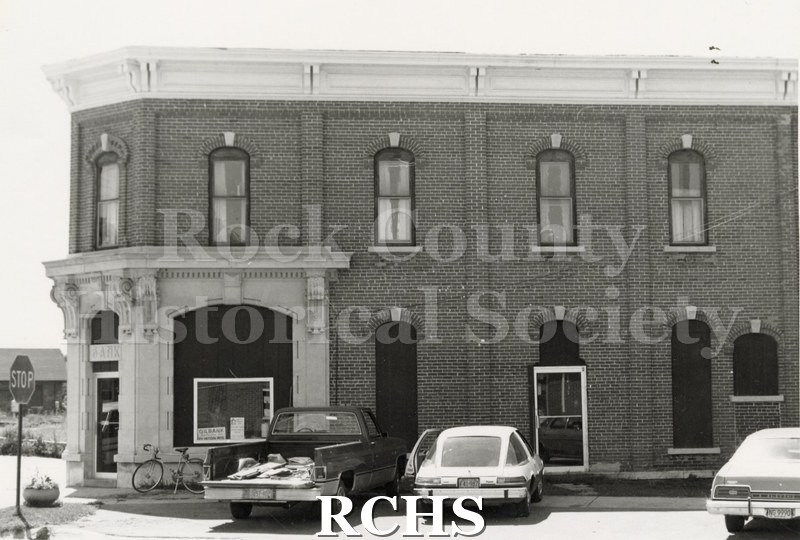 Black and white photograph of Gilbank, Clinton, Wisconsin, a two story brick building.