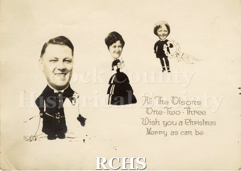 Historic image of Christmas card showing three people.