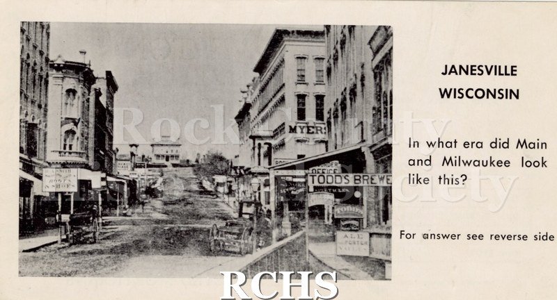 Black and white photograph of Overton Funeral Home card showing a scene from early Janesville, Wisconsin.
