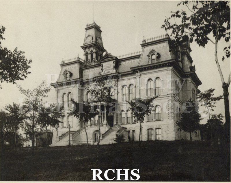 Black and white photograph of Rock County Court House. Shows trees in front.