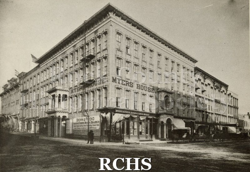 Black and white photograph of Myers House. This is a four story building with Brown & Friend Manufacturers Branch on the ground floor.