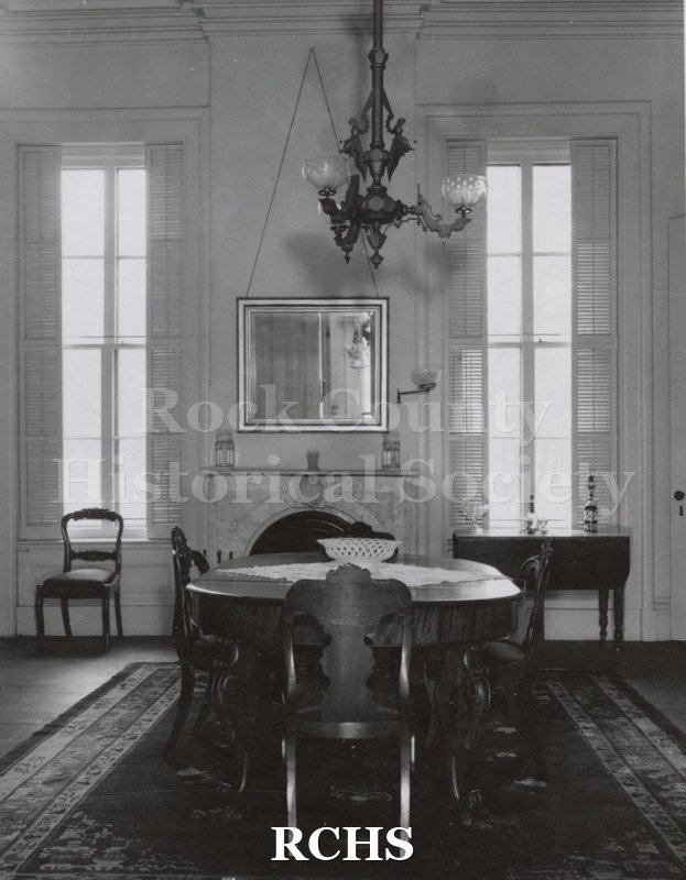 Black and white photograph of the dining room in the Tallman House.