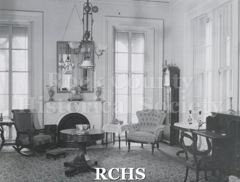 Black and white photograph of the family parlor in the Tallman House.