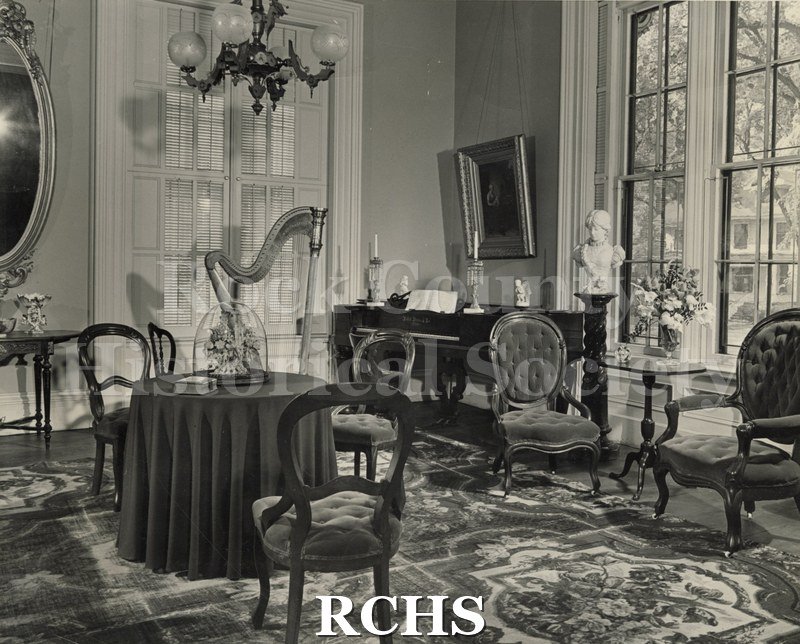 Black and white photograph of the formal parlor at the Tallman House.